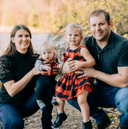 Image of mom (Samantha), daughter (Sephora), and rest of happy family.